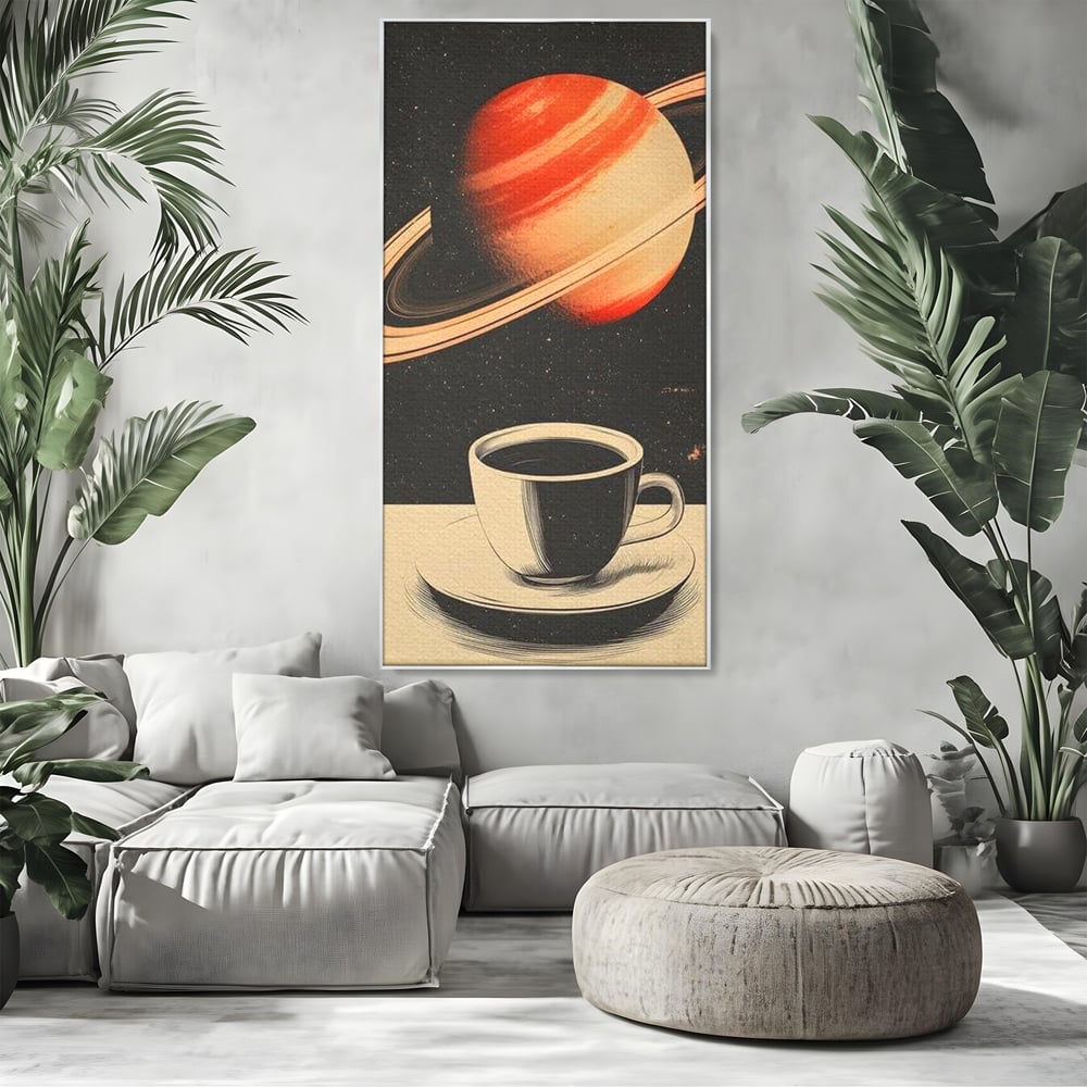 Tablou canvas cu ilustratie cu ceasca de cafea si planeta saturn, in rama de aluminiu argintiu, pe perete intr-un living